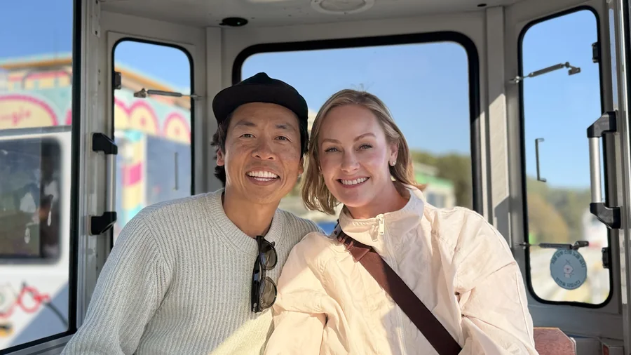 A couple photographed together, close and unposed